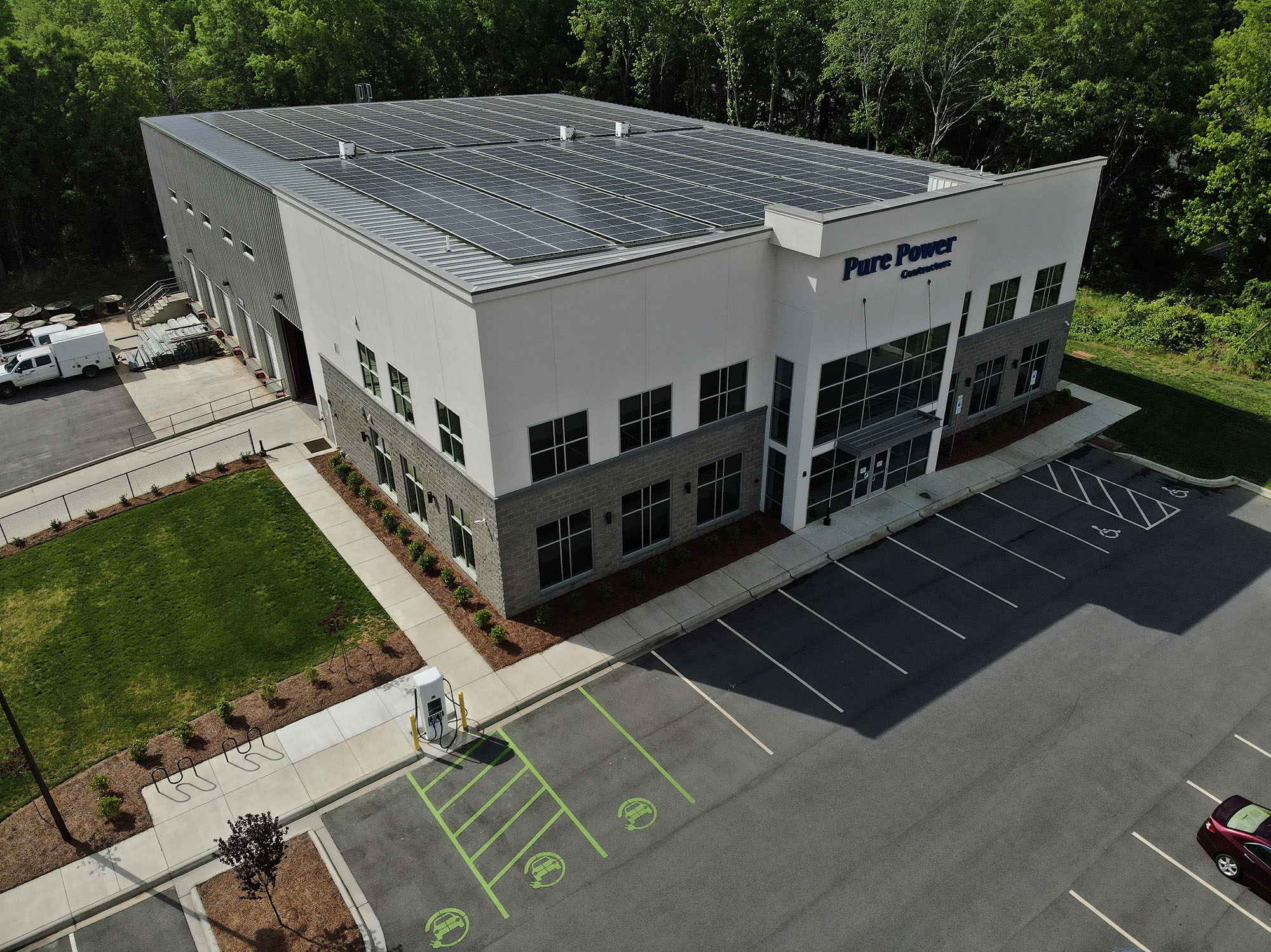 Aerial view of Pure Power Contractors headquarters in Monroe, North Carolina, with rooftop solar panels