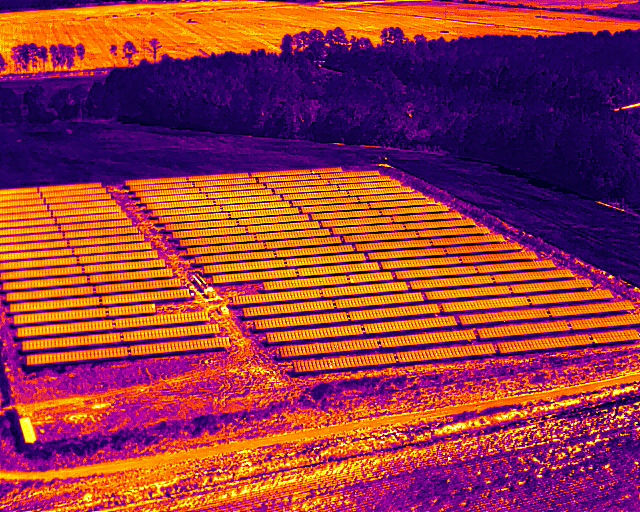 Aerial thermal infrared scan of a solar panel array showing heat signature patterns